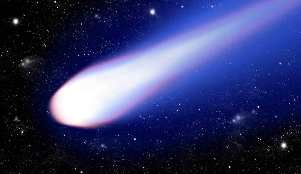 Cometa con una coda di luce blu